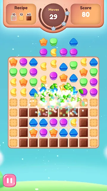 Chocolate blockers being broken along the lower half of a cookie grid